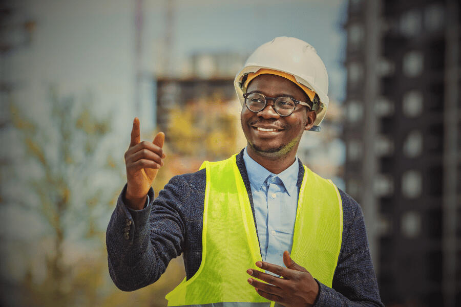 A business team surrounding a laptop is happy about lead generation results.