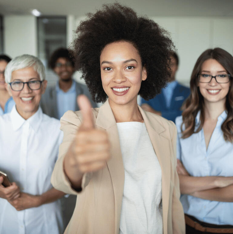 woman thumbs up leads croud of professional people